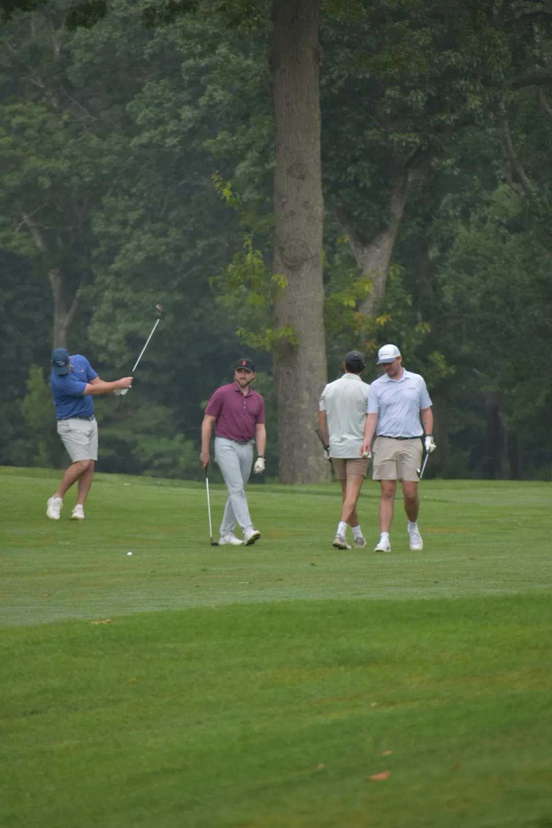 Men cheering while playing golf